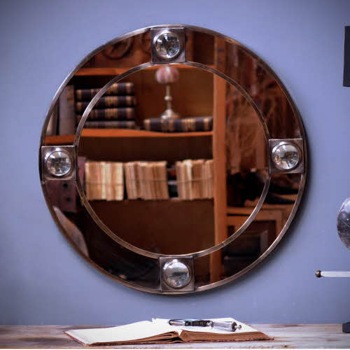 Round brass mirror with magnifying glass